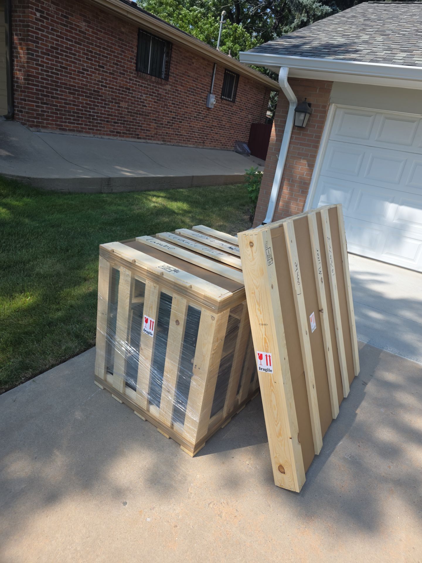 Ceramic grill secured inside its custom wood crate